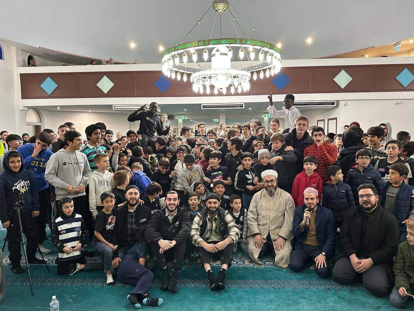 ICMG Brothers Youth gathered together at a community event.